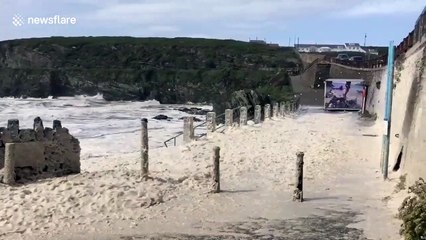 Watch as Storm Ellen brings swirling sea-foam and huge breakers crashing onto the Anglesey shoreline