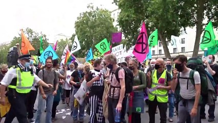 Extinction Rebellion in London makes it rain 'blood money'