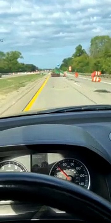 Over-Sized Load Sends Construction Cones Flying