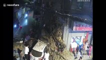 Shop collapses after being crashed into by car, injuring two in China