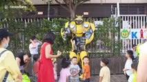 Chinese father wears self-made 'Transformers' costume to surprise son in kindergarten