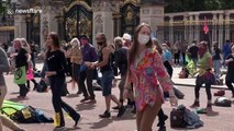Hundreds of Extinction Rebellion protesters disco dance outside Buckingham Palace in London