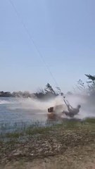Guy Slams Into Water While Kitesurfing