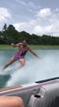 Guy Performs Tricks While Wake Surfing