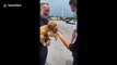 Florida nurse surprises girlfriend with adorable goldendoodle puppy
