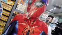 Filipino shopper wears Spiderman costume and face shield amid COVID-19 pandemic
