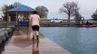Guy Falls in Water While Brisk Walking on Slippery Dock