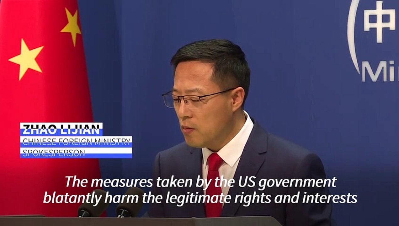China rips into Trump order revoking visas of 1...