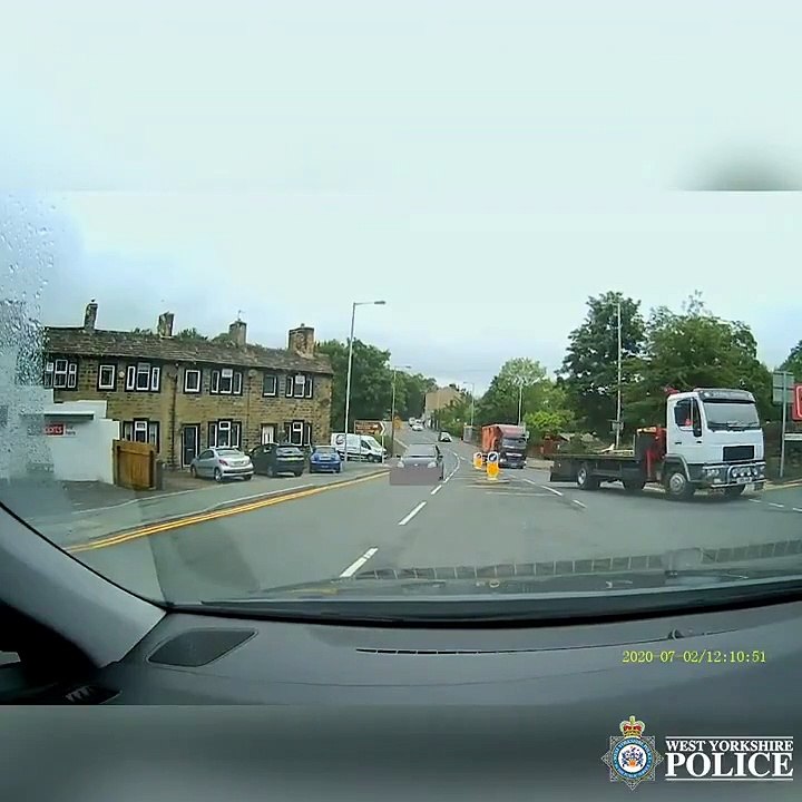 Dash cam footage shows moment driver overtakes lorry on wrong side of the road