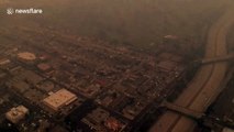 Drone footage of Californian city shrouded in darkness due to smoke clouds from wildfires