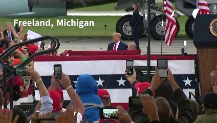 Trump defends 'Keep calm and carry on' approach on virus crisis at Michigan rally
