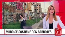 Barrotes sostienen un muro por la obra inconclusa en la calle 45 de Bogotá