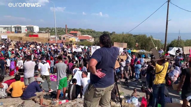 Displaced migrants on Lesbos island protest in wake of fire at Moira camp