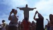 a crowd of tourist visits the statue of christ the redeemer in rio de janeiro