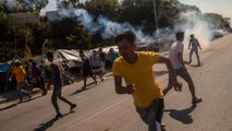 Greek police fire tear gas as refugees demand to leave Lesbos