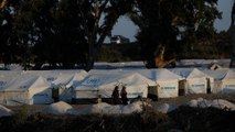Greek authorities begin to move Moria refugees to new camps