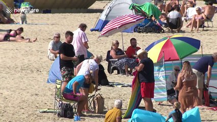 UK's late summer heatwave sees many hit the beach as 'Rule of Six' comes into effect