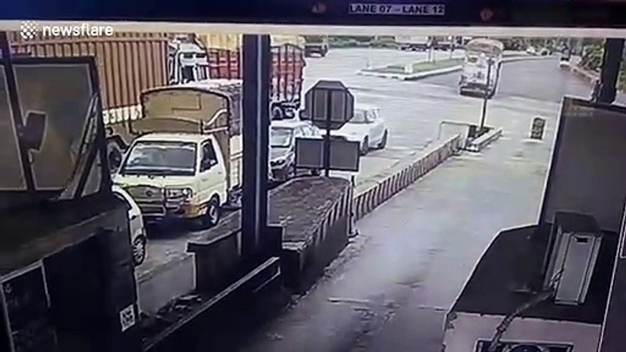 Truck loses control and rams into multiple vehicles at toll booth in southern India
