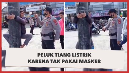 Hukuman Menggantung Memeluk Tiang Listrik karena Tak Bermasker