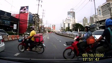 Show-off motorcycle rider crashes while pulling wheelie at junction