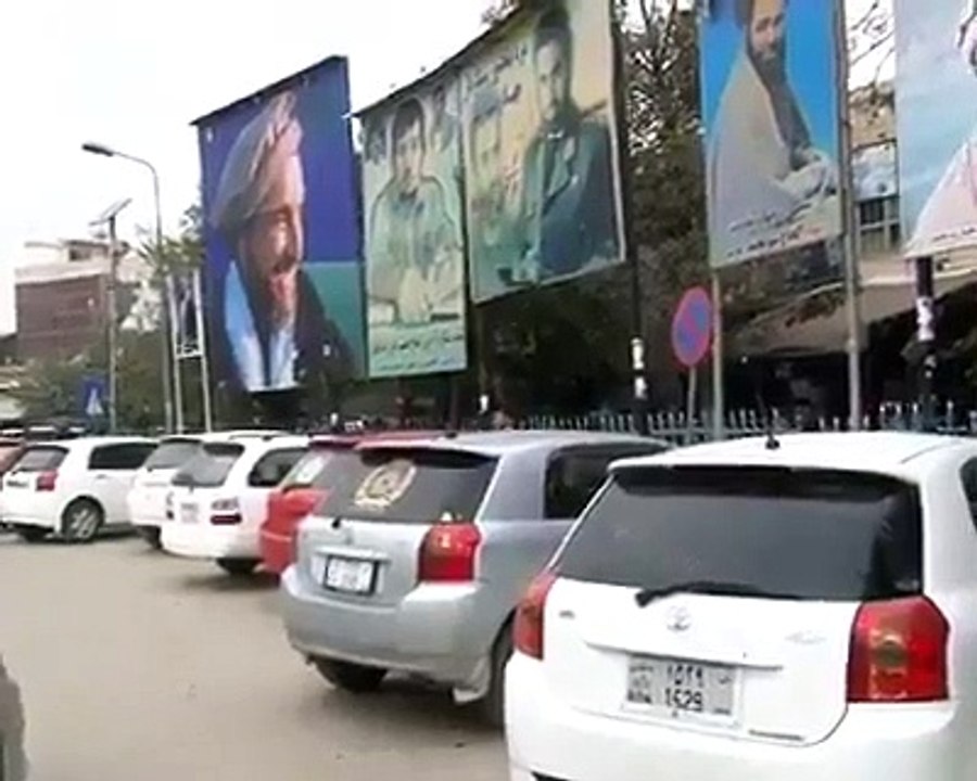 Police break window mirrors of vehicles avoiding tented mirrors in Afghanistan