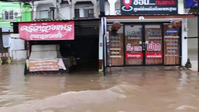 Vehicles drive through flooded streets as Typhoon Noul hits Thailand