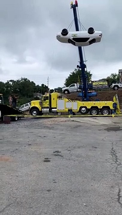Towing Company Owners Use Crane and Car for Gender Reveal