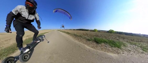 Paramotor Operator Surprises Mountain Board Rider in French Landscape