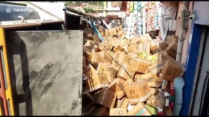 Lucky escape for roadside bystanders when truck flips in northern India