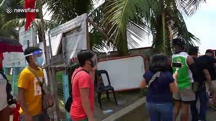 New synthetic 'white sand beach’ draws crowds in Philippines