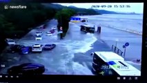 High tide waves sweep away vehicles on road after crashing over bank in China