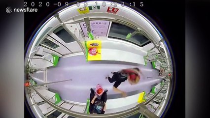 Chinese police officer frees girl hanging upside down on train handrail after getting foot stuck