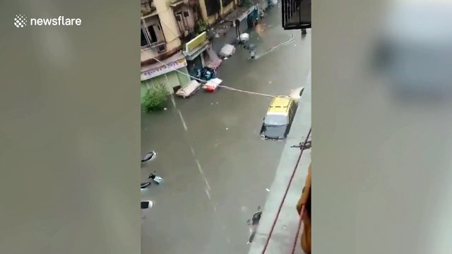 Flooded streets and vehicles submerged as Mumbai hit by heavy rainfall