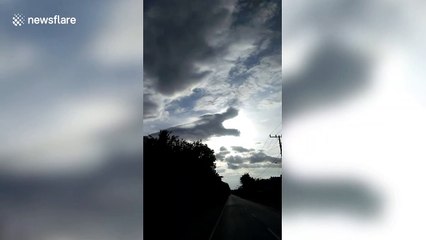 Bizarre dragon cloud appears to be eating the sun in Indonesia