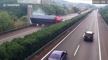 Chinese motorist luckily escapes death after transport truck flips on car on highway