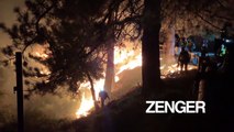 California firefighters set strategic fire to build wildfire containment line