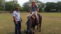 Laurie riding a bull in Costa Rica