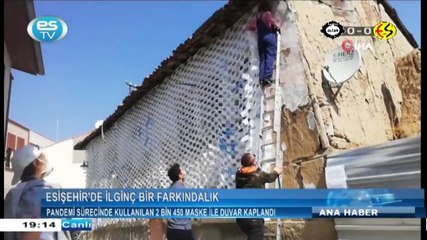 Evin duvarını maskelerle kapladı