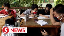 Indonesian students trade trash to study online