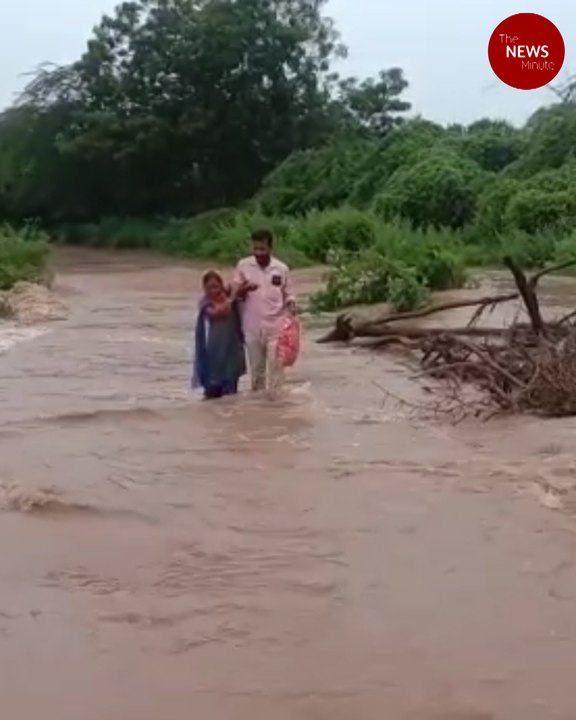 Andhra village volunteer crosses swollen stream to deliver pensions