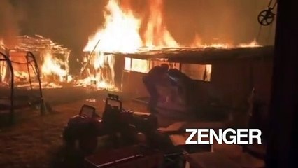 Firefighters drive through Glass Fire