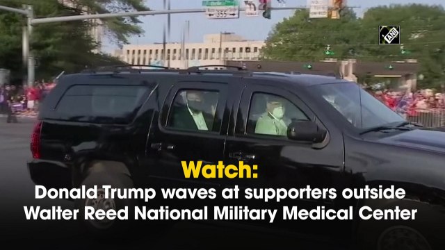 Donald Trump waves at supporters outside Walter Reed National Military Medical Center