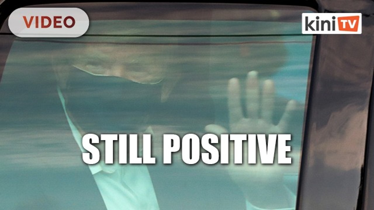 Infected Trump greets supporters outside hospital