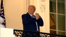 US President Donald Trump takes mask off as he arrives at White House