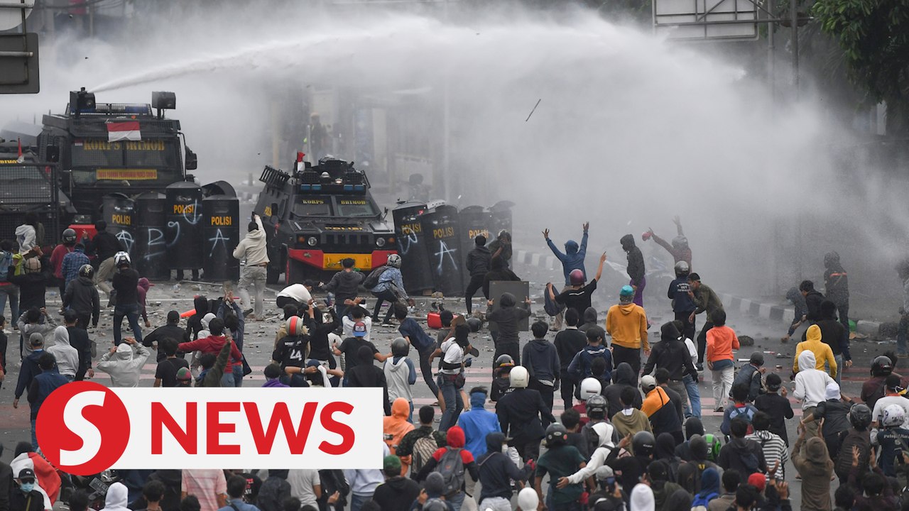Police and demonstrators clash in Indonesia over labour law protest