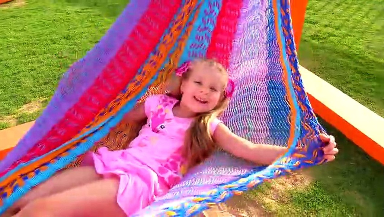 Diana and Roma play with Dad at the playground