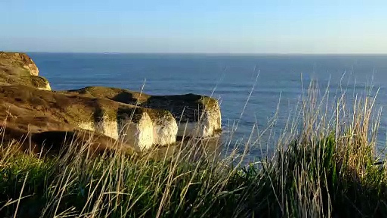 Cliffs Aerial shot over a sandy coastline natural beautiful royalty Free Stock no copyright video Free for commercial use dron dron aerial view