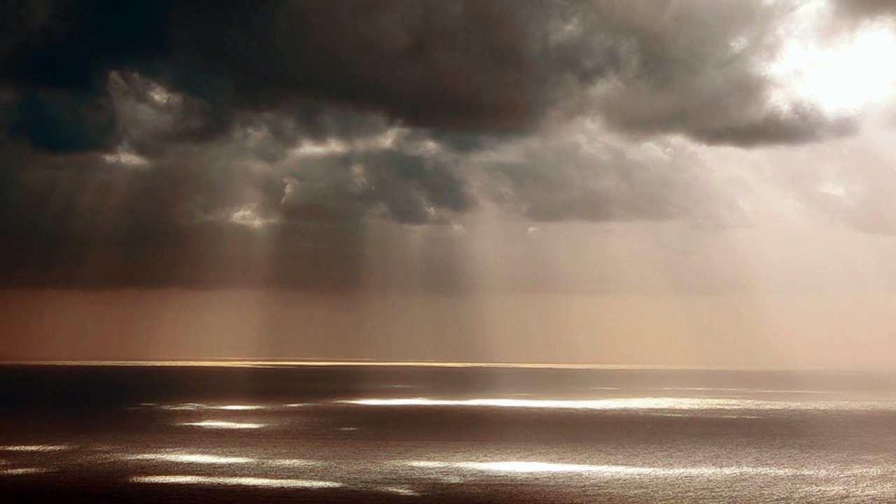 Clouds Light Sea Aerial shot over a sandy coastline natural beautiful royalty Free Stock no copyright video Free for commercial use dron dron aerial view