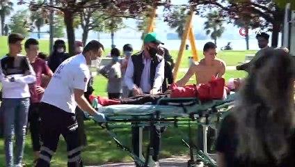 Patenleriyle demir çitin üzerinden atlamaya çalışan genç ölümden döndü