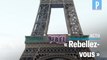 Extinction Rebellion déploie une banderole sur la tour Eiffel